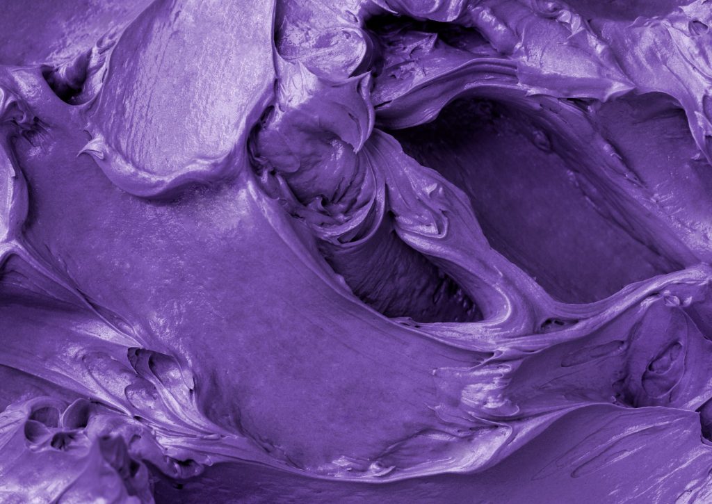 Purple frosting texture background close-up